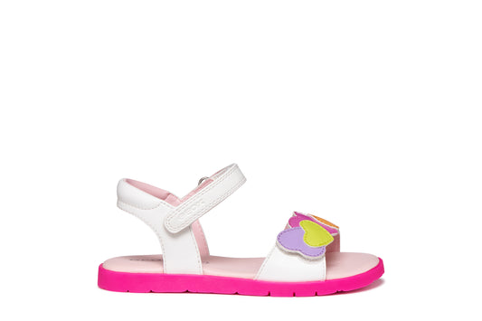A girls sandal by Geox, style Joyfoot in white/multicolour with velcro strap, multicolour heart detailing on front and pink sole. Right side view