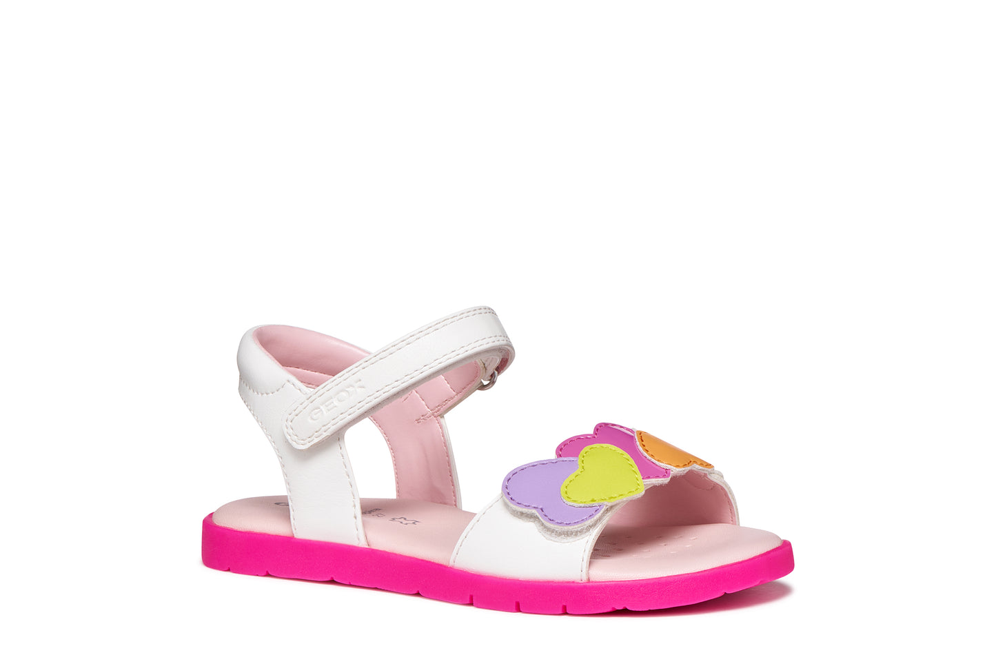 A girls sandal by Geox, style Joyfoot in white/multicolour with velcro strap, multicolour heart detailing on front and pink sole. Angled side view