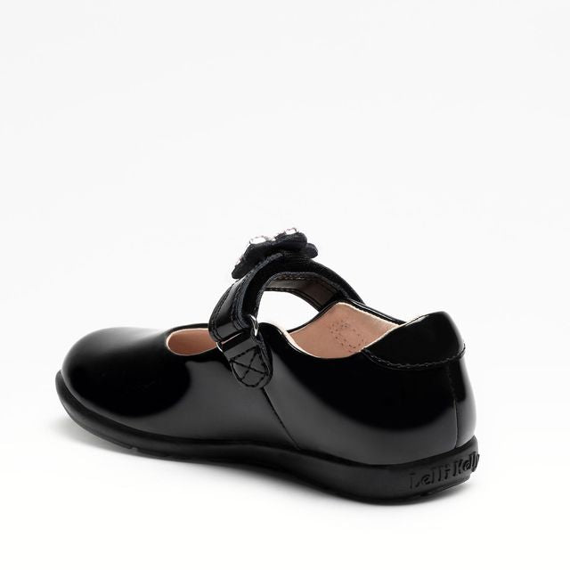 A girls Mary Jane school shoe by Lelli Kelly, style LKSO8481CVR Daisy, in black patent with detachable daisy embellished attachment. Velcro fastening. Angled left side view.