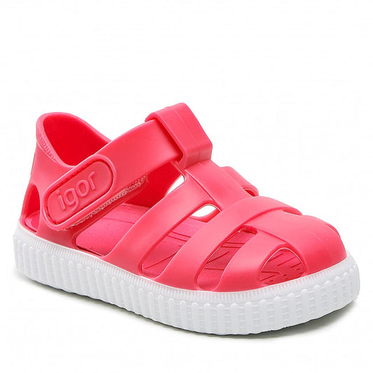 A unisex closed toe jelly shoe by Igor, style Nico, in red and white with velcro fastening. Angled view of right side.