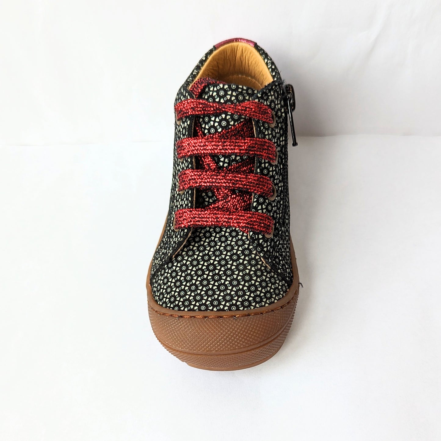 A girls ankle boot by Bopy, style Jolila, in black/silver print nubuck with toe bumper and zip/ bordeaux glitter lace fastening.  Front view.