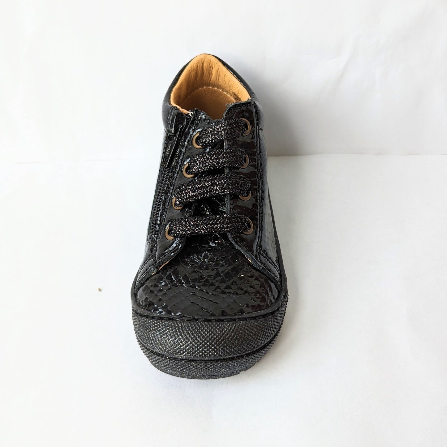 A girls ankle boot by Bopy, style Joseva, in black patent leather croc with toe bumper and zip/glitter lace fastening . Front view.