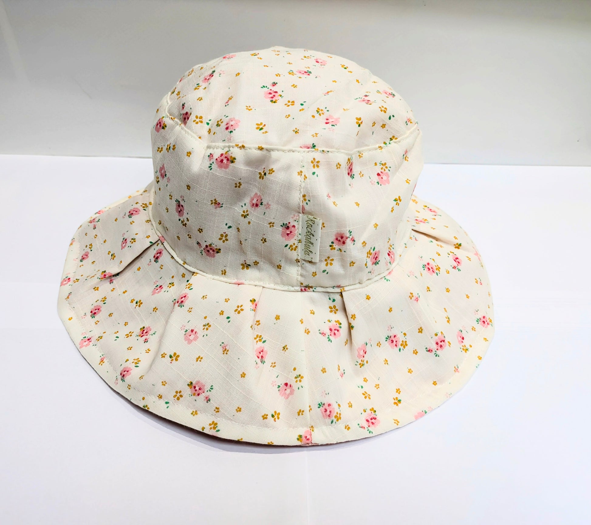 A white floral sun hat by Rockahula on a white background