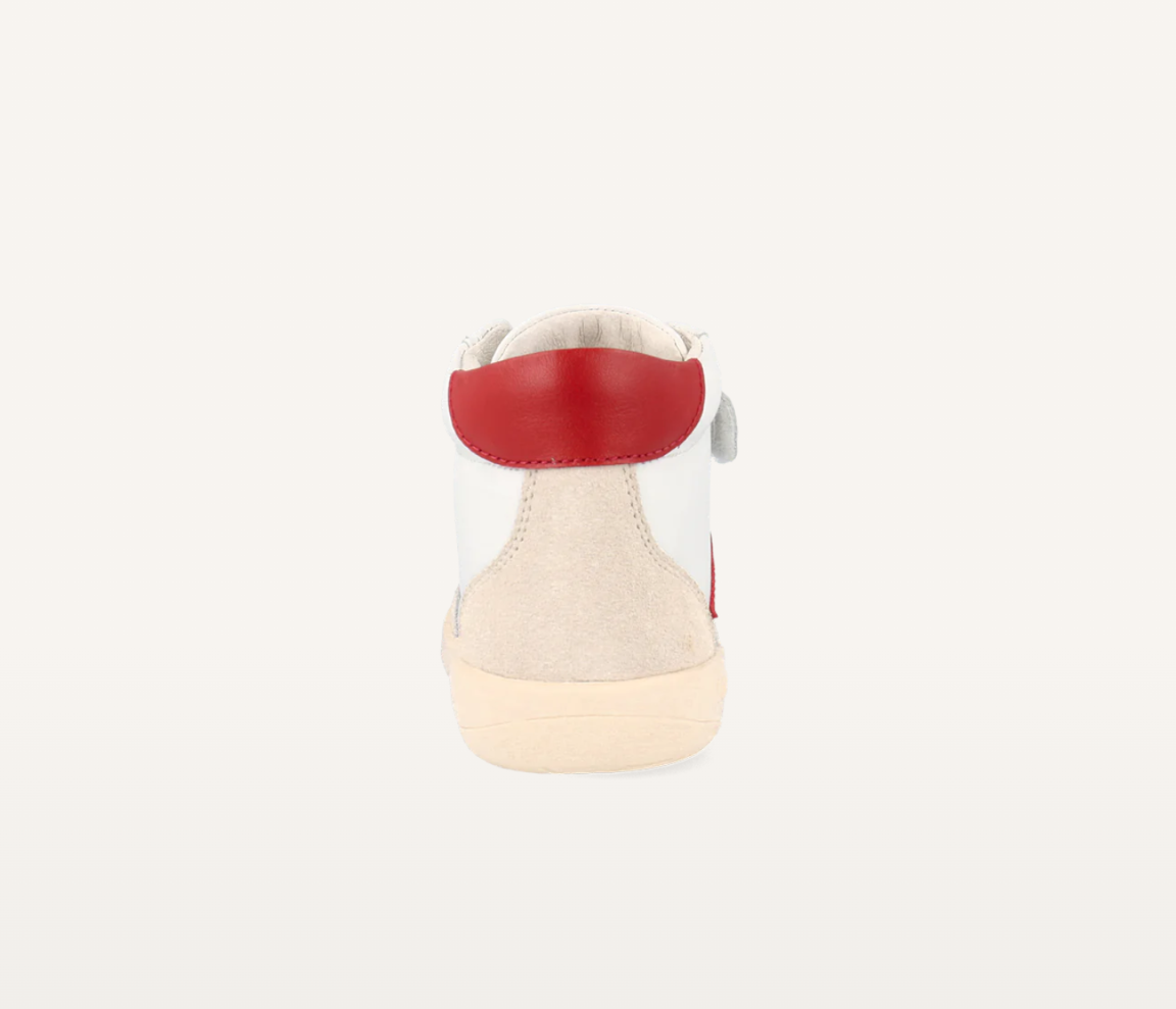 A unisex high top casual boot by Bobux, style Champ, in white with pink and red trim and double velcro fastening. Back view.