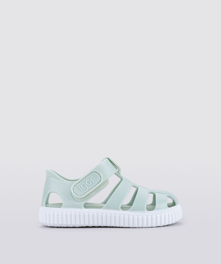 A unisex Jelly shoe by Igor , style Nico in mint green with white sole, velcro fastening. Right side view.