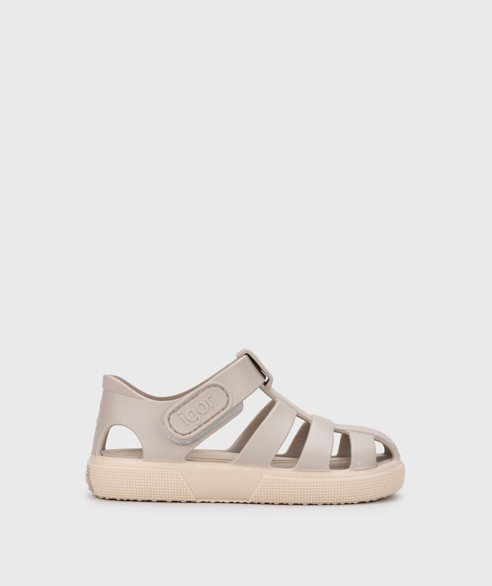 A child's closed toe unisex jelly sandal by Igor, style Bay, in sand with cream sole with velcro fastening. Right side view.