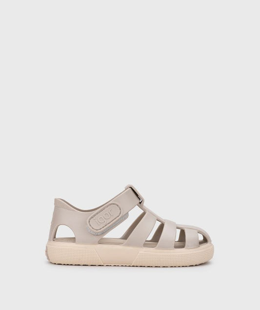 A child's closed toe unisex jelly sandal by Igor, style Bay, in sand with cream sole with velcro fastening. Right side view.