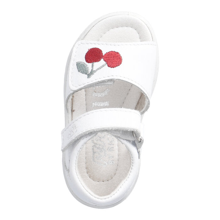 A girls sandal by Ricosta, style Mimi in white cherry, with two velcro straps, one with cherry detail. Top view