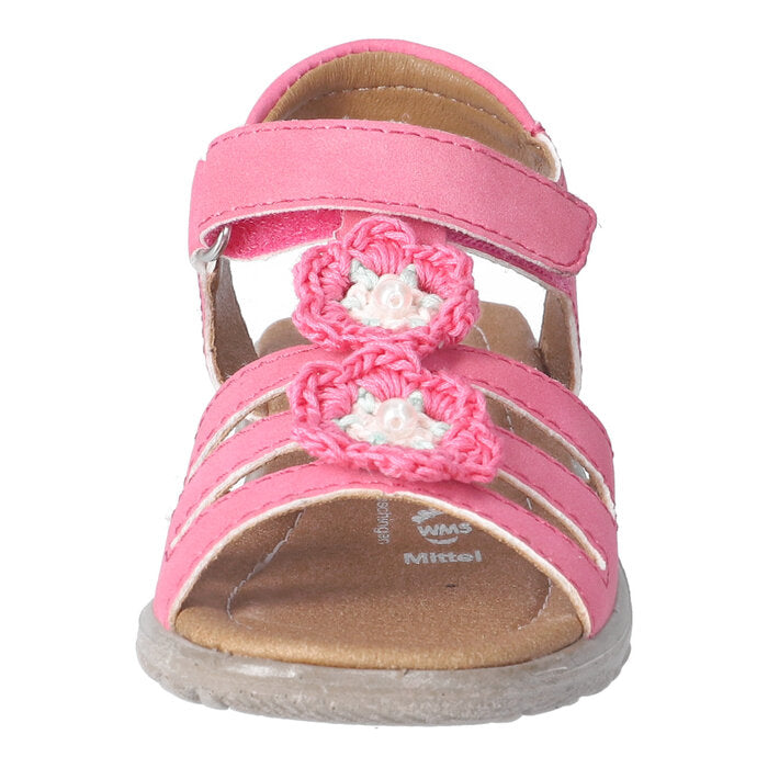 A girls sandal by Ricosta in style Camilla in pink, with crochet flower details and velcro strap. Front view