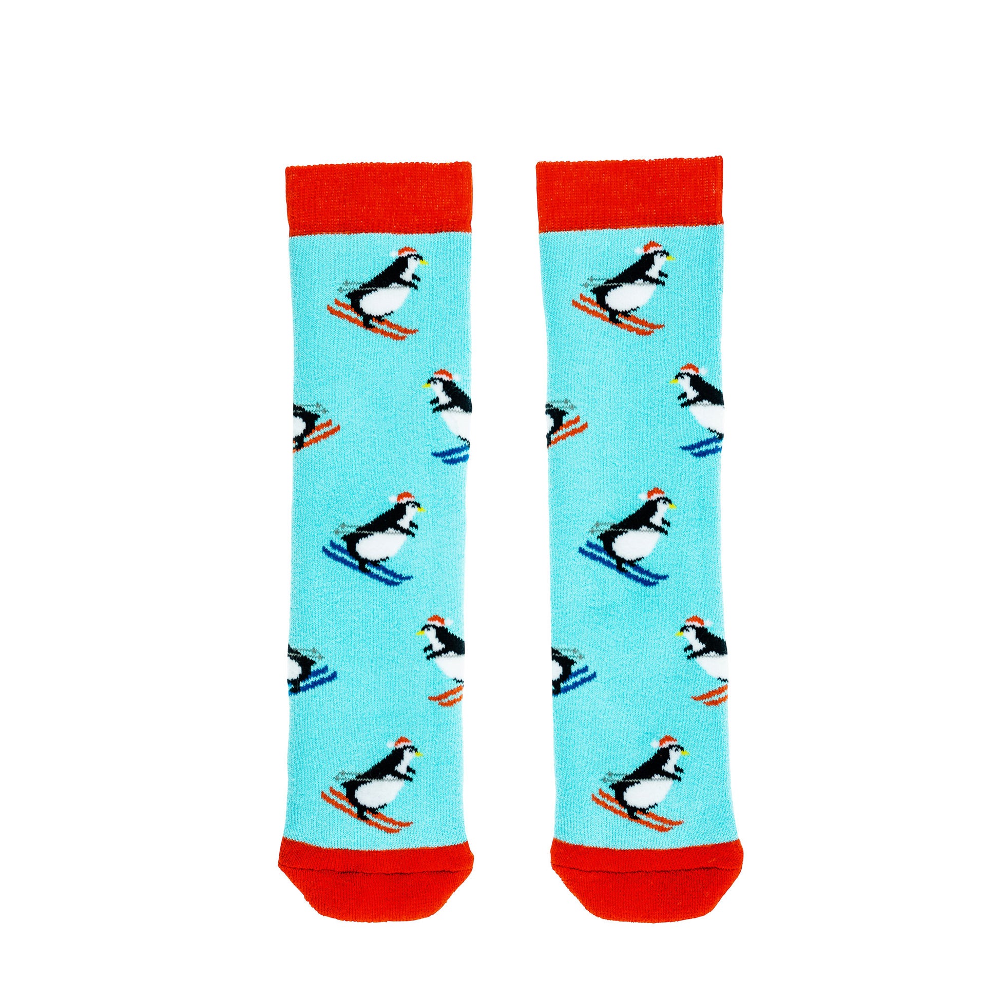 A pair of Mini welly socks by Squelch, style Penguins, in turquoise with skiing penguin print and red trim. Front view.