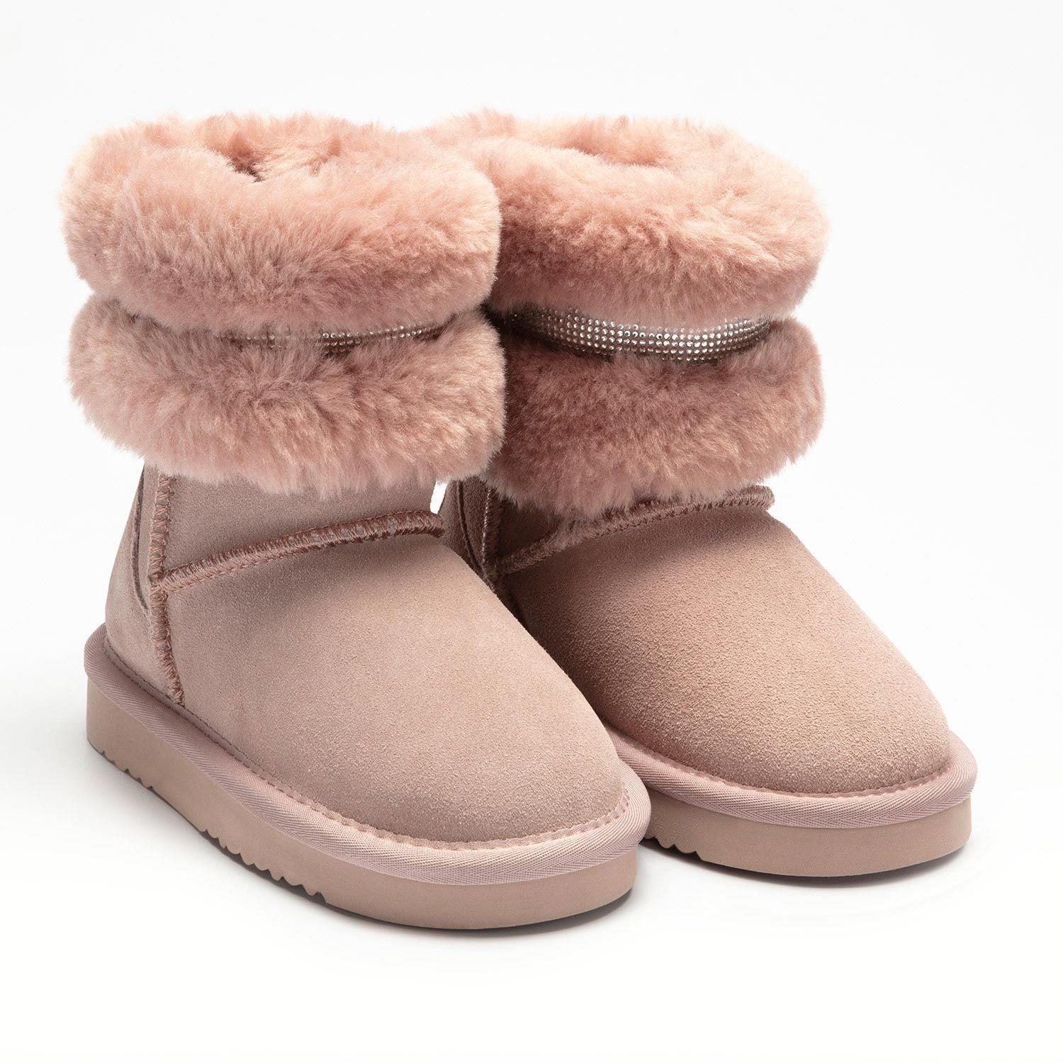 A pair of girls pull on calf length boots by Lelli Kelly, style LKHA3766, in blush pink suede with fur cuff and diamante trim. Angled view.