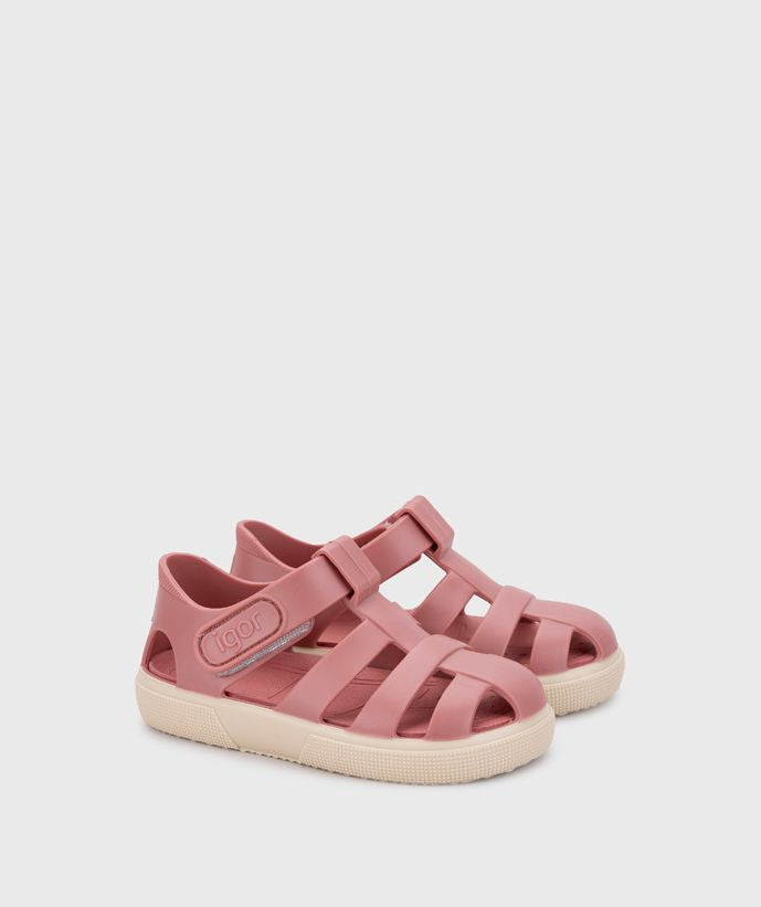 A child's closed toe unisex jelly sandal by Igor, style Bay, in green with cream sole with velcro fastening. Angled right side view of a pair.