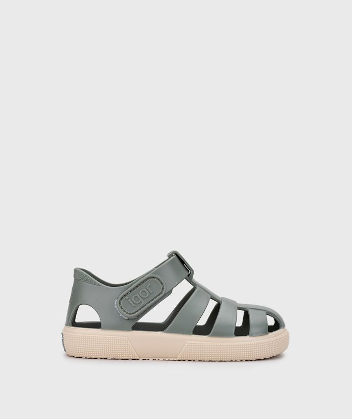 A child's closed toe unisex jelly sandal by Igor, style Bay, in green with cream sole with velcro fastening.  Right side view.