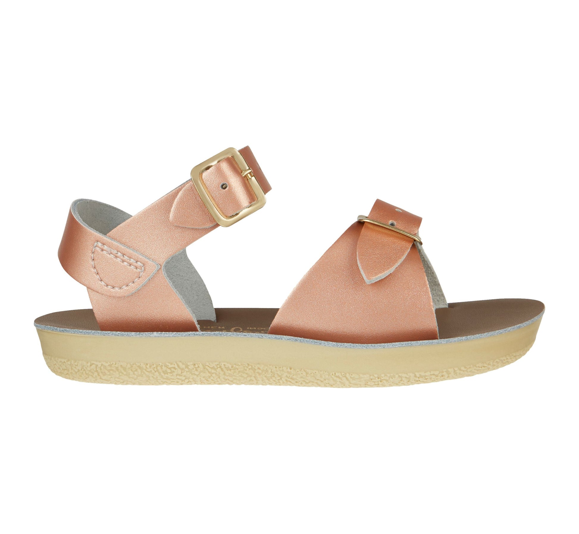 A girls sandal by Salt Water, style Surfer  in rose gold, buckle fastening. Left side view.