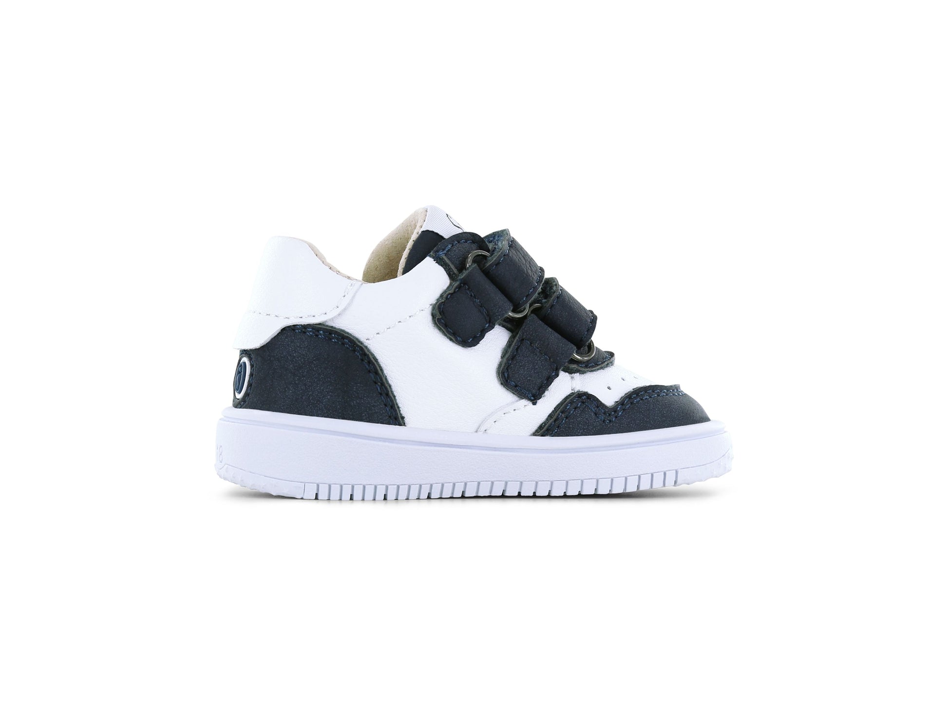 A boys mid top trainer by Shoesme, style BN2S006-B in white and navy, double velcro straps. Left inner side view.
