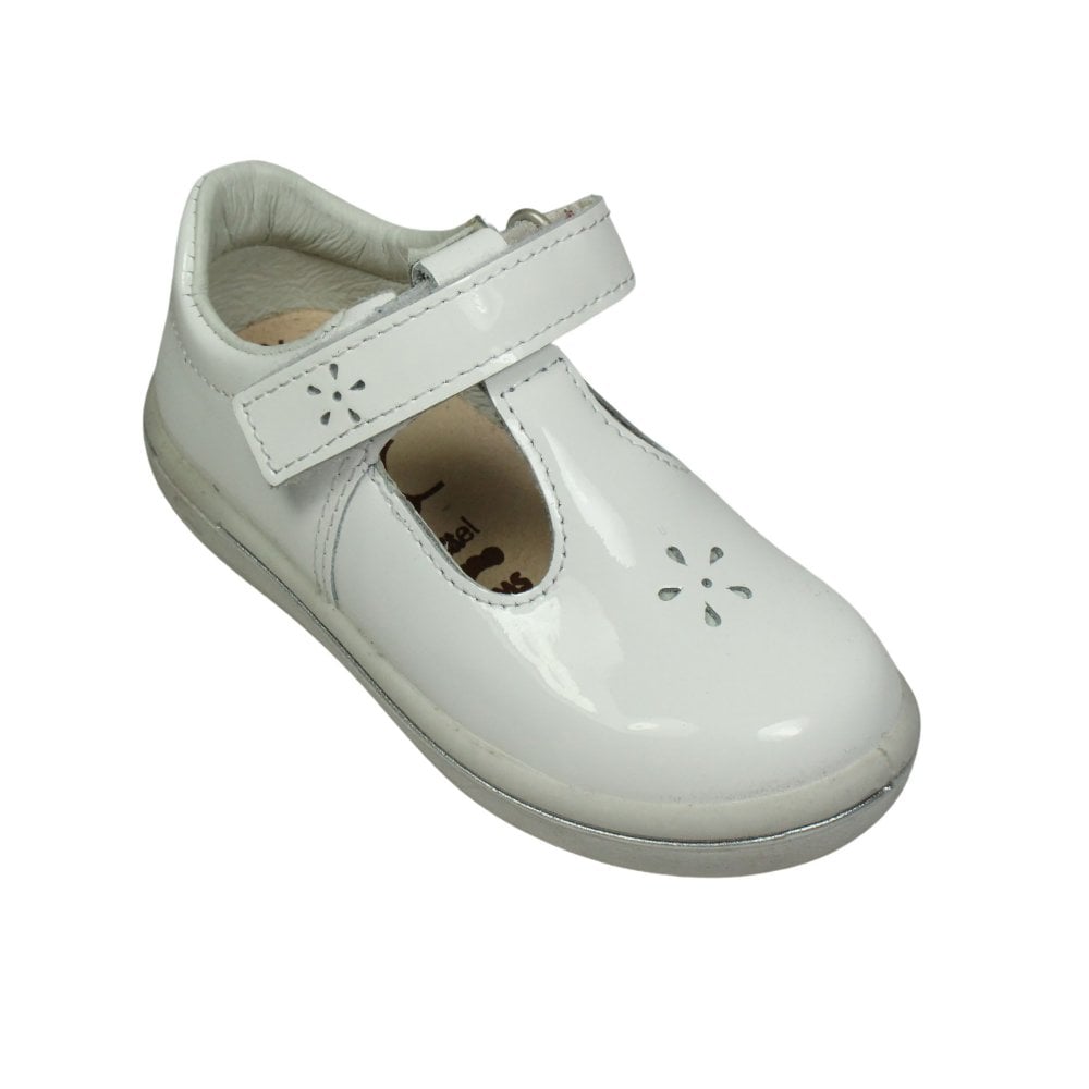 A girls T bar shoe by Ricosta, style Winona, in white patent leather with velcro fastening. Angled view.