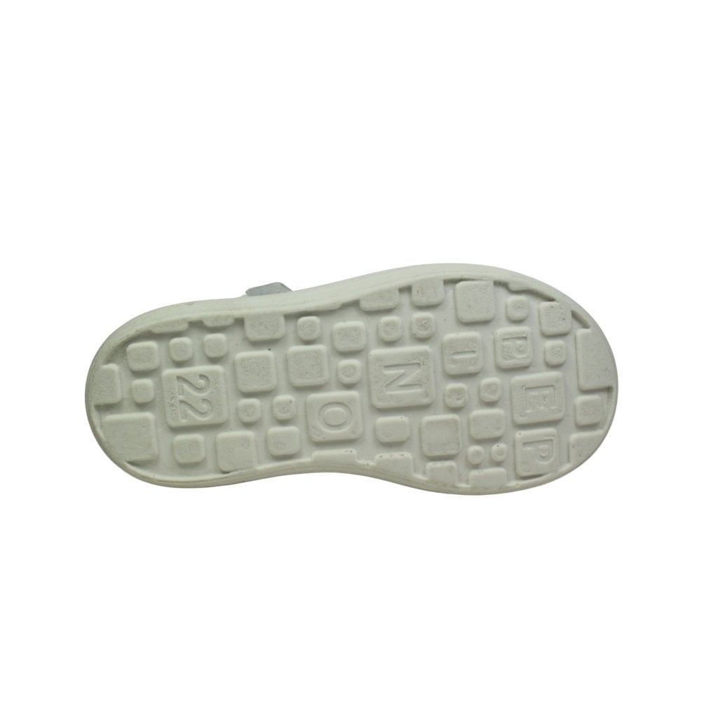 A girls T bar shoe by Ricosta, style Winona, in white patent leather with velcro fastening. View of sole.