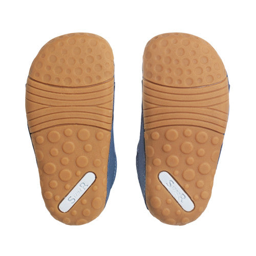 A boys pre-walker by Start-Rite, style Dinky, in blue with a dinosaur motif on the velcro strap. Sole view of a pair.