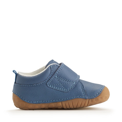 A boys pre-walker by Start-Rite, style Dinky, in blue with dinosaur motif on the velcro strap. Left inner side view.