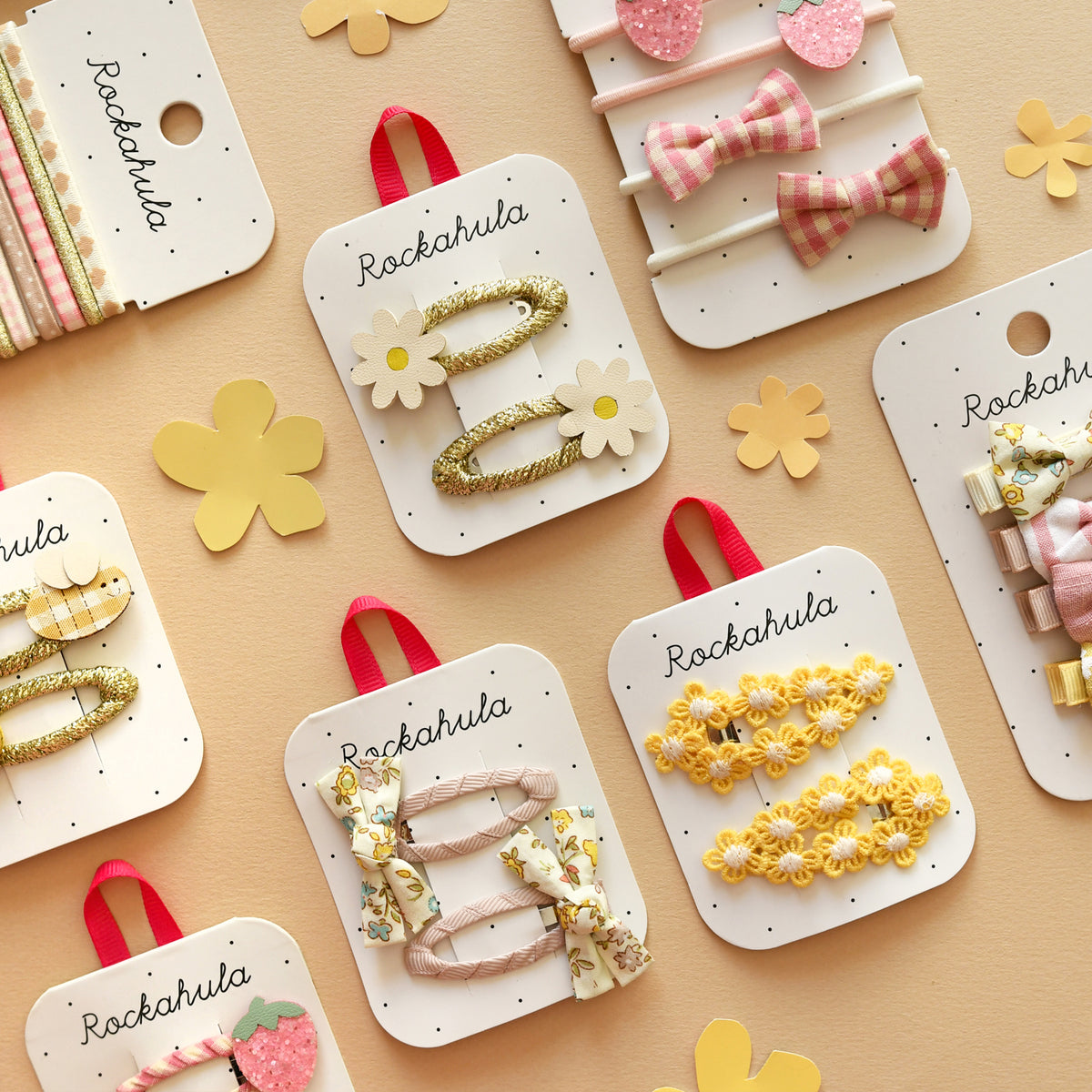 Collection of Rockahula hair accessories on display with colorful packaging.