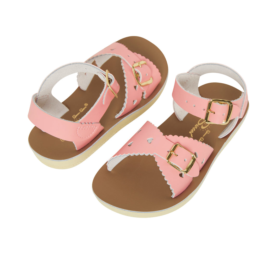 A girls sandal by Salt Water, style Sweetheart in pink, buckle fastening. Pair view.
