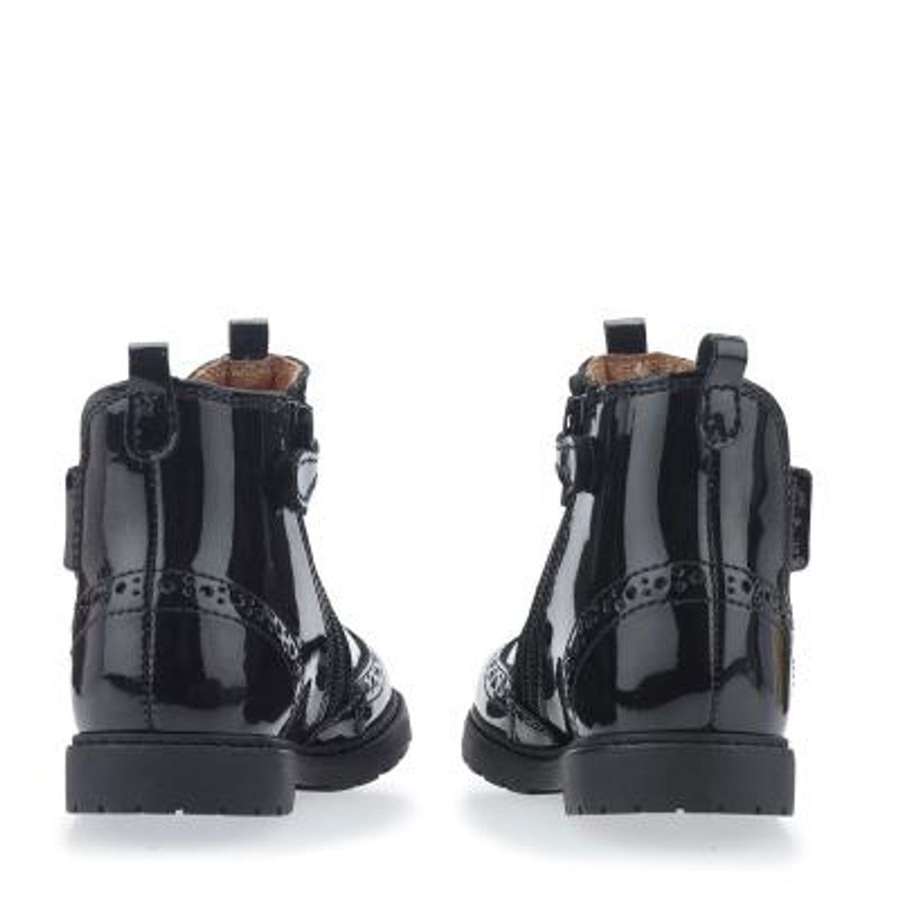 A girls Chelsea boot by Start-Rite, style Chelsea in black patent leather with brogue detail, elastic side panel and zip fastening. Back view of pair.