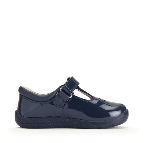A girls t-bar shoe by StartRite, style Puzzle in patent navy, with flower design on the front and glitter in a black sole. Inner left side view