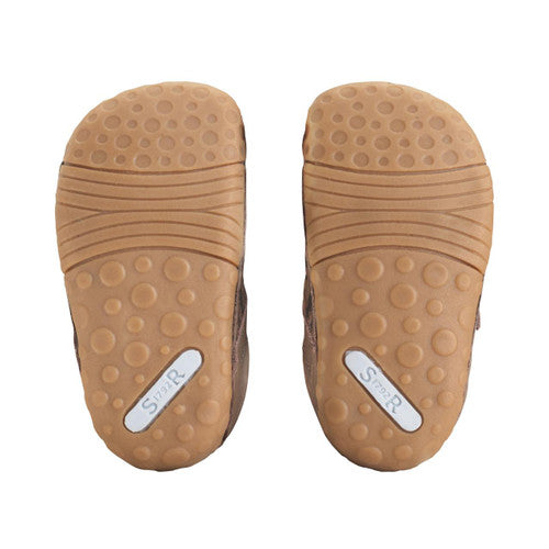 A boys pre walker by Start-Rite, style Roar, in taupe nubuck with dinosaur print and velcro fastening. Sole view.