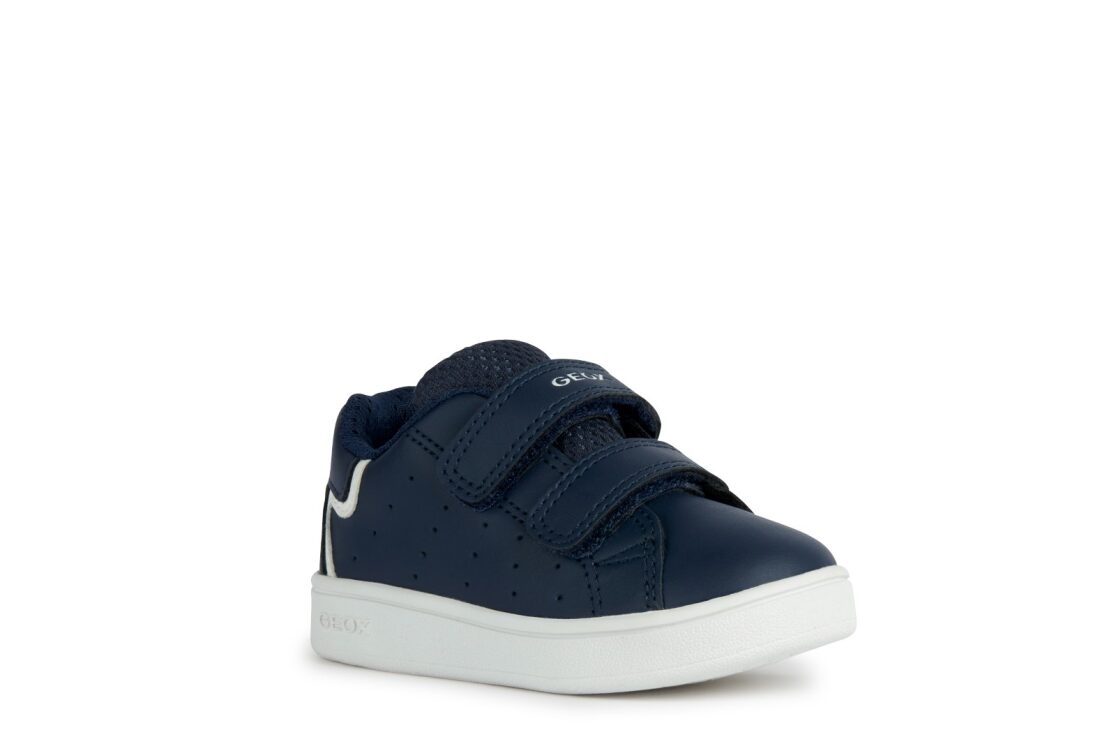A boys casual shoe by Geox, style B Eclyper in navy with white trim, double velcro fastening. Angled right side view.