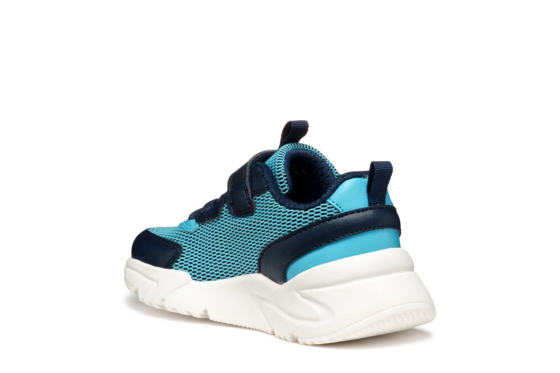 A boys trainer by Geox, style J Loftus in sky /  navy. Velcro fastening and elastic laces. Inner right angled view.