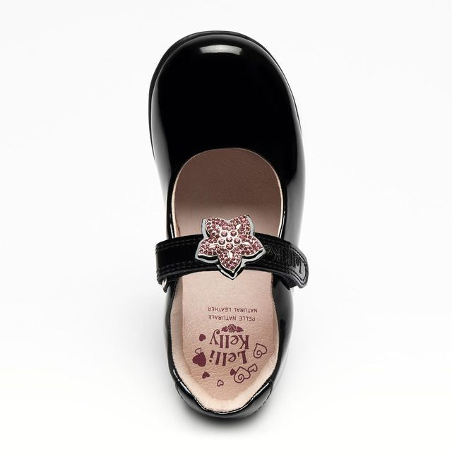 A girls Mary Jane school shoe by Lelli Kelly, style LKSO84B1CVR Daisy, in black patent with detachable daisy embellished attachment. Velcro fastening. View from above.