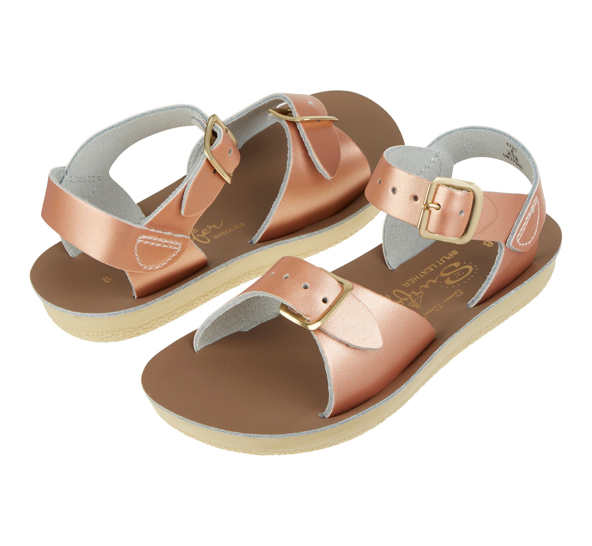 A girls sandal by Salt Water, style Surfer in rose gold, buckle fastening. Top to toe view of a pair.