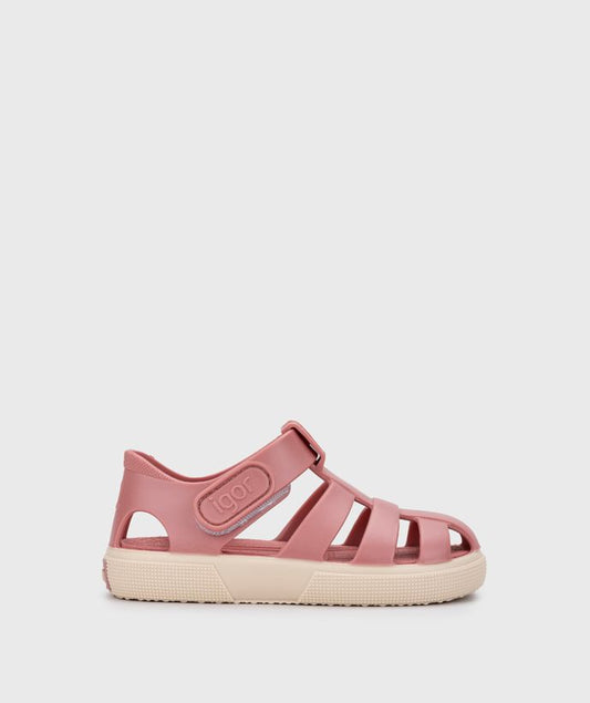 A girl's closed toe jelly sandal by Igor, style Bay, in pink with cream sole with velcro fastening. Right side view.