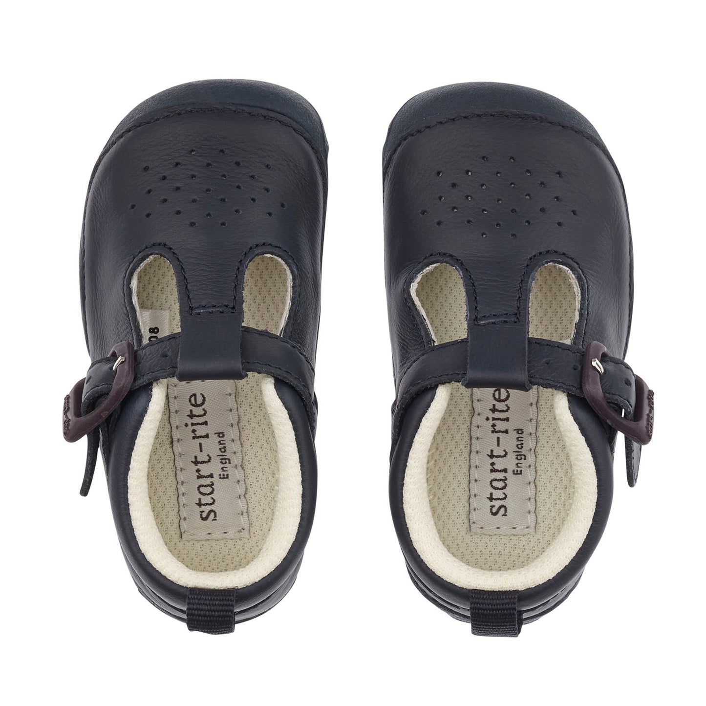 A boys T-Bar shoe by Start-Rite, style Baby Jack, in navy leather with punch out detail and buckle fastening. View of pair from above.