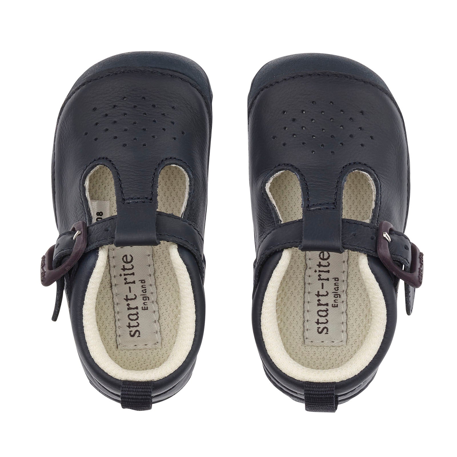 A boys T-Bar shoe by Start-Rite, style Baby Jack, in navy leather with punch out detail and buckle fastening. View of pair from above.
