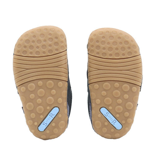 A pair of boys pre walkers by Start-Rite, style Shuffle, in navy and blue nubuck leather with velcro fastening. View of soles.