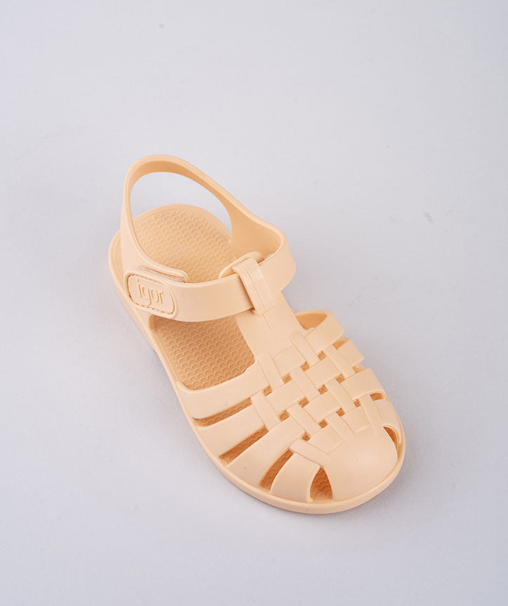 A unisex closed toe sandal by Igor,style Clasica, pastel orange with velcro fastening. Above view.