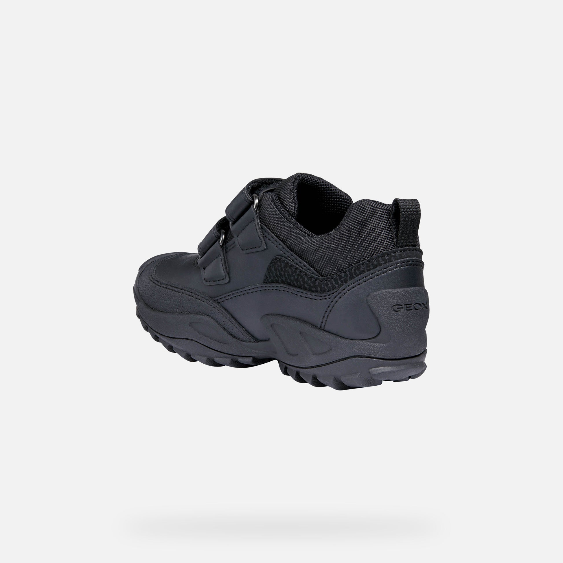 A casual waterproof school shoe by Geox, style J new Savage,in black with double velcro fastening. Inner side view.