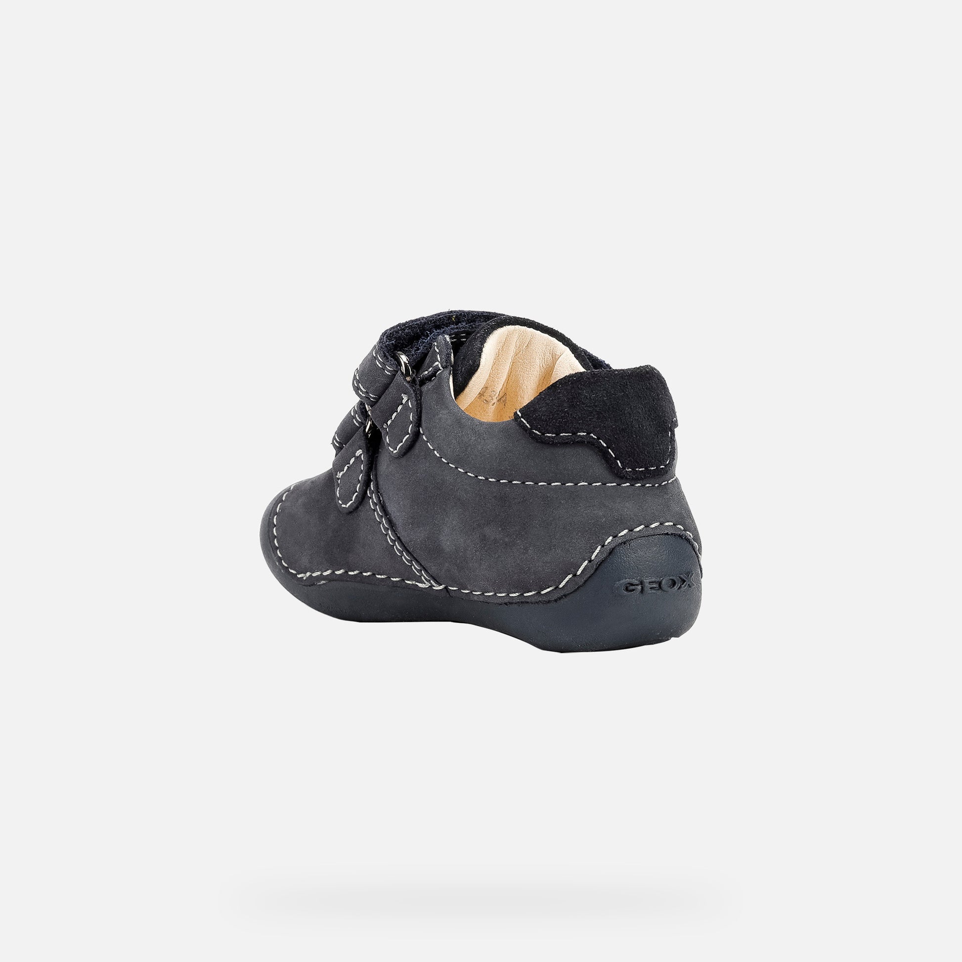 A boys pre walker by Geox, style Tutim, in navy with double velcro fastening. Back view.